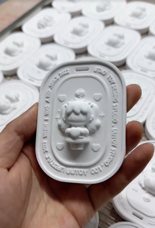 3D character girl oval plaster aroma diffuser stone with custom embossed lettering manufactured by Custom Candle Craft