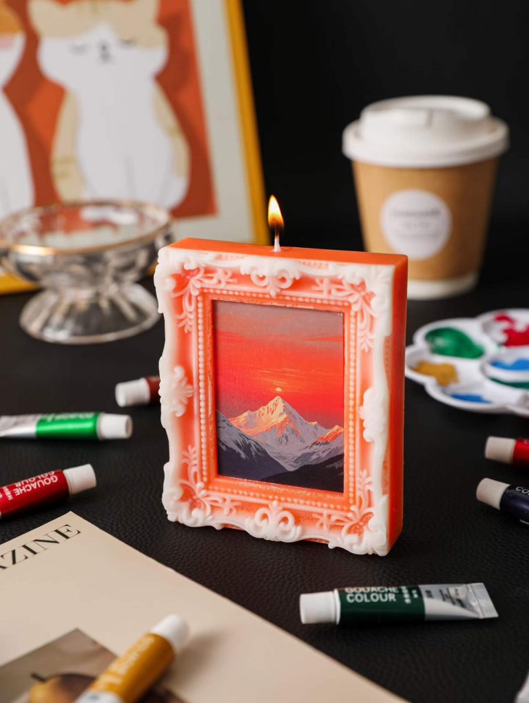 Artistic orange mountain sunset picture frame soy candle with oil paint tubes and palette decor