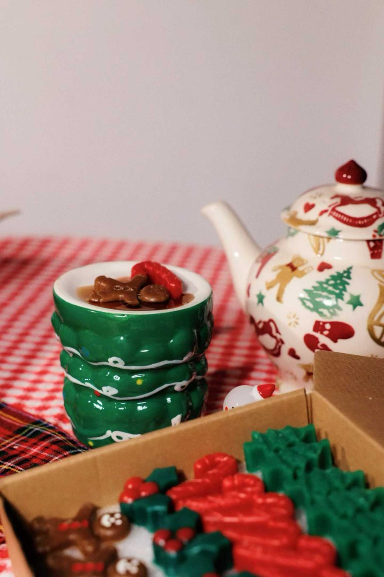 Kraft cardboard gift box filled with Christmas tree and gingerbread man wax melts
