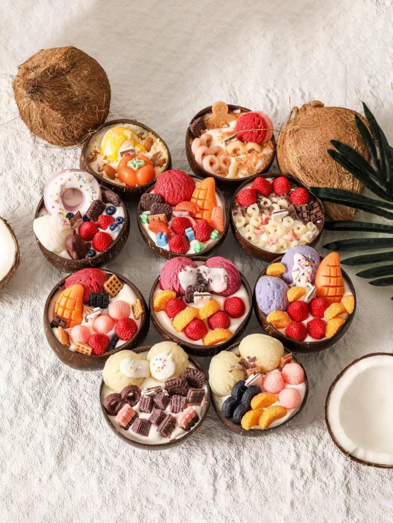 Natural coconut bowl fruit parfait dessert soy candles topped with berries and chocolates