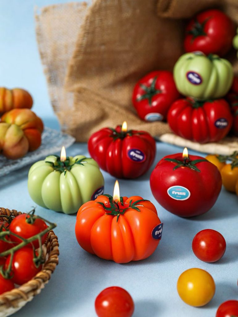 Harvest red tomato, orange pumpkin, and green pepper soy candles for autumn collections