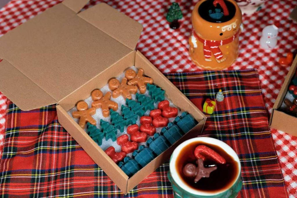 Holiday gingerbread man and Christmas tree soy wax melts in kraft cardboard box