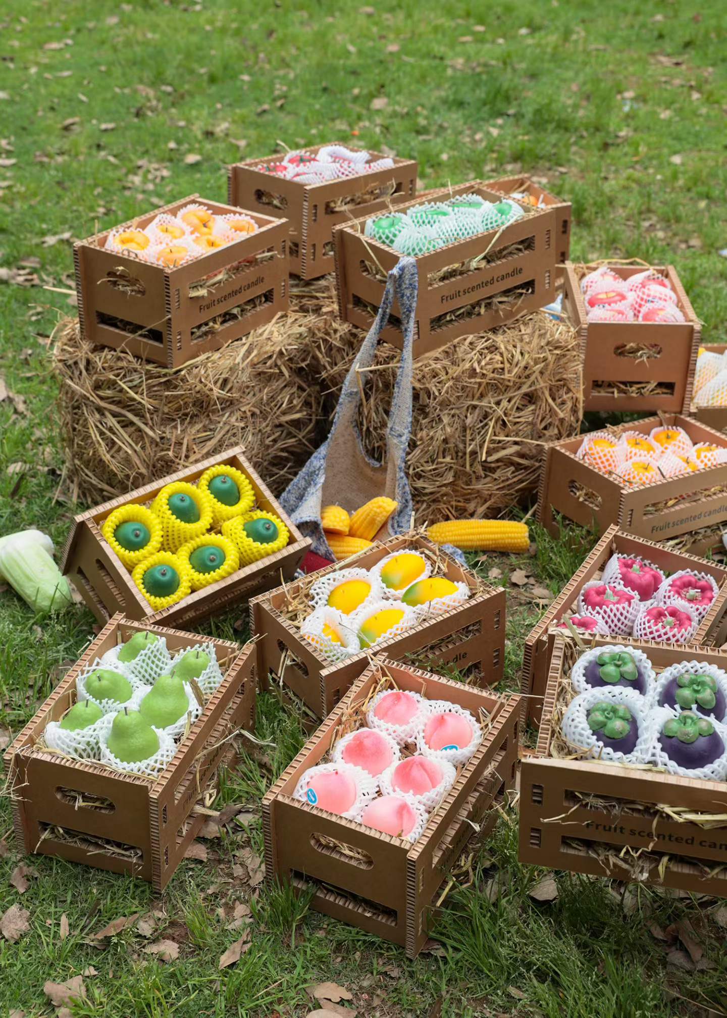 Wholesale wooden crates displaying assortment of realistic fruit and vegetable soy candles