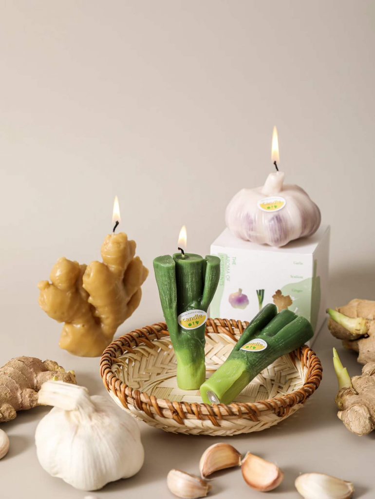 Realistic ginger, garlic, and culinary spice soy candles in kitchen basket setting