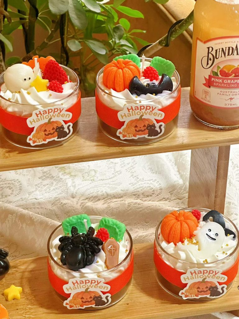 Wholesale custom Halloween dessert parfait glass cup soy candles with whipped wax cream and miniature ghost pumpkin embeds.