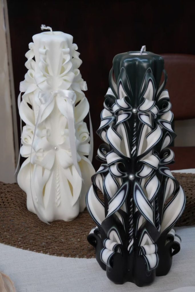 Pair of large XL statement hand carved pillar candles in classic white and gothic black finishes